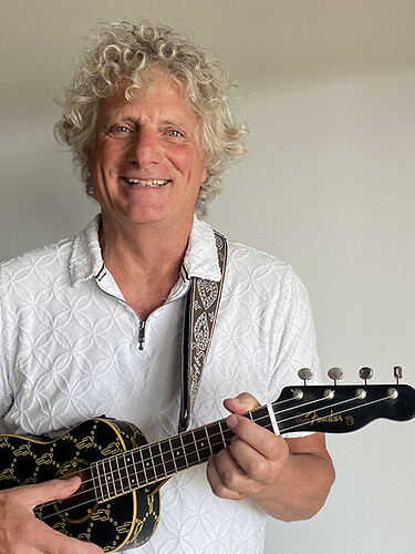 Paul Stacey holding his ukulele