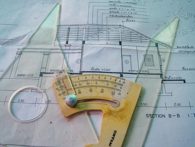 architecture tools atop a building plan