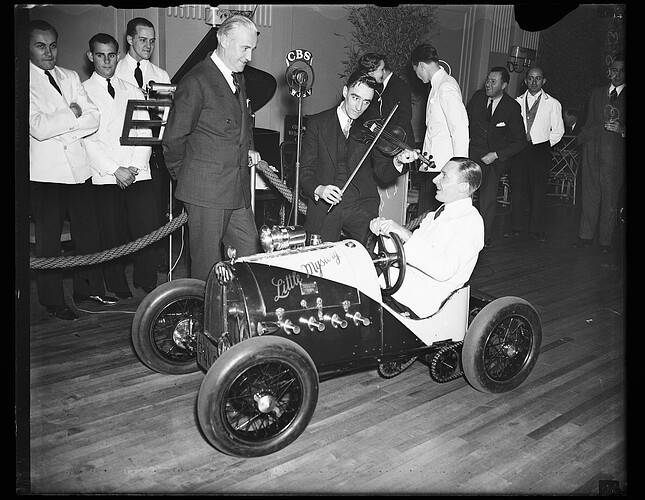 Kenneth L. Morehouse and his midget car "Little Mystery," probably taken at an event at a hotel, Washington, D.C.