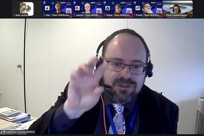 Man speaking enthusiastically hand held in air