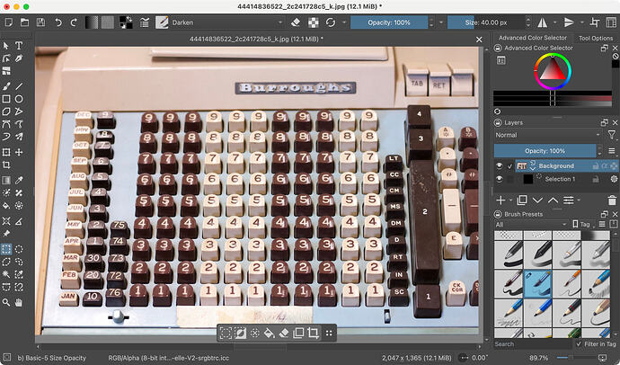 Graphic editor interface software with two columns of icons on left and a stack of various palettes on right. The image being edited is an old adding machine