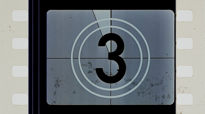 Number 3 in a circle on old film