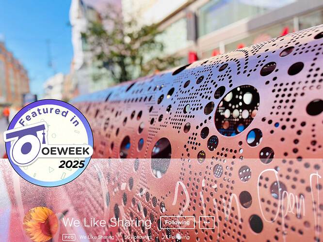 We like sharing site and a featured in OEWeek 2205 badge over a gorgeous photo of a red metal bench on a daylight lit street