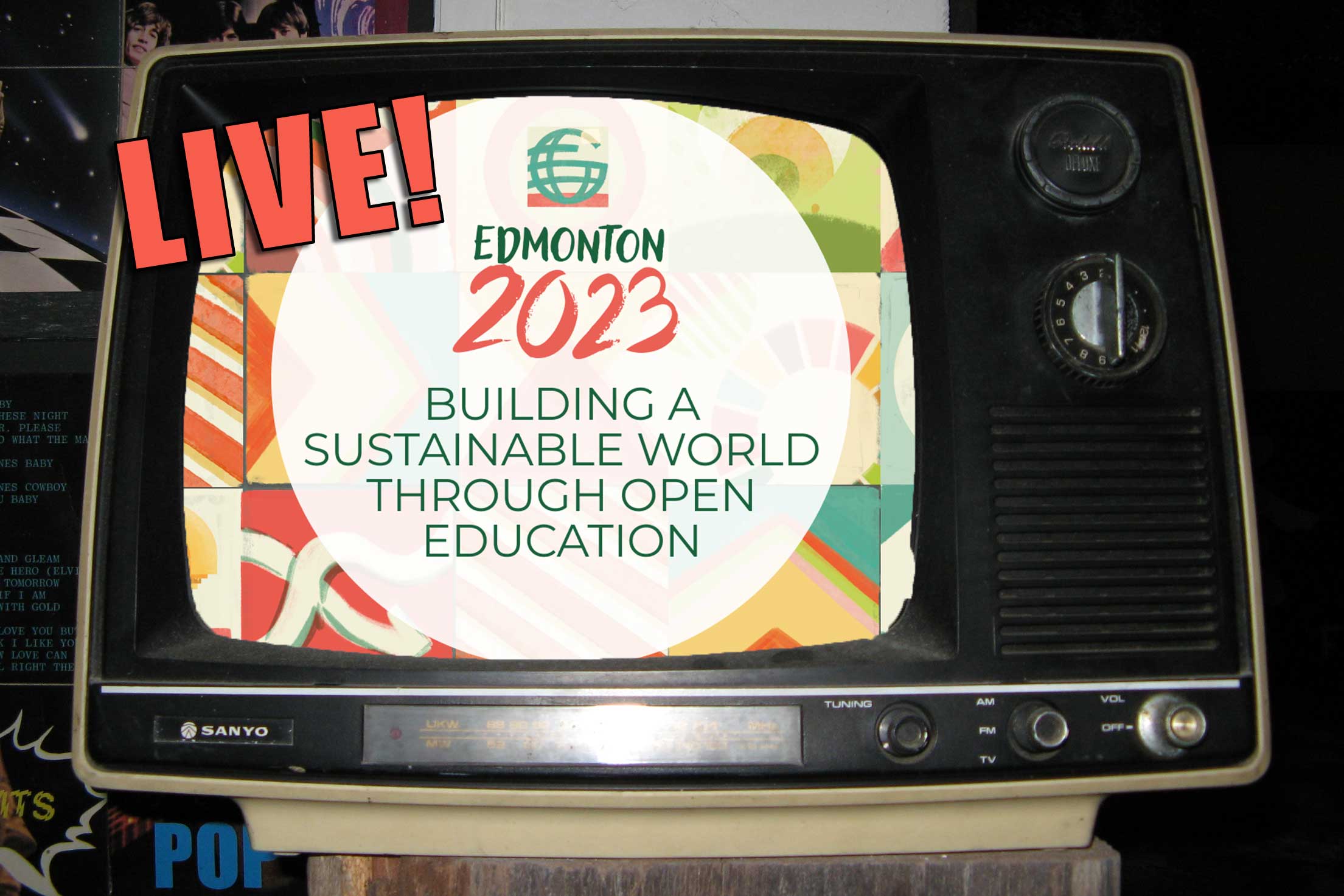 Old TV screen displaying large text reading "LIVE!" atop the  conference title, Building a Sustainable World through Open Education