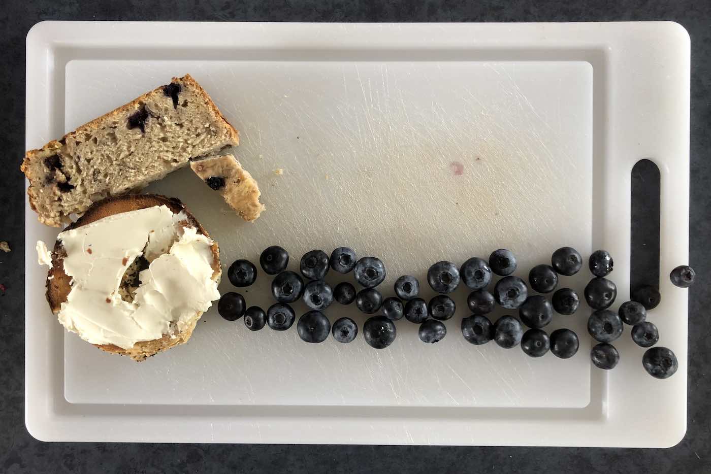 OEweek as a bagel with banana bread plus blueberries spelling the event name